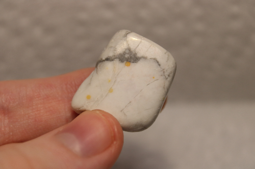 Polished white stone with black veins.